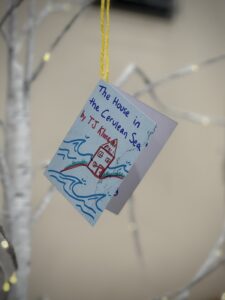 Photo of a hand-drawn copy of a book cover. The book is The House in the Cerulean Sea by TJ Klune.
